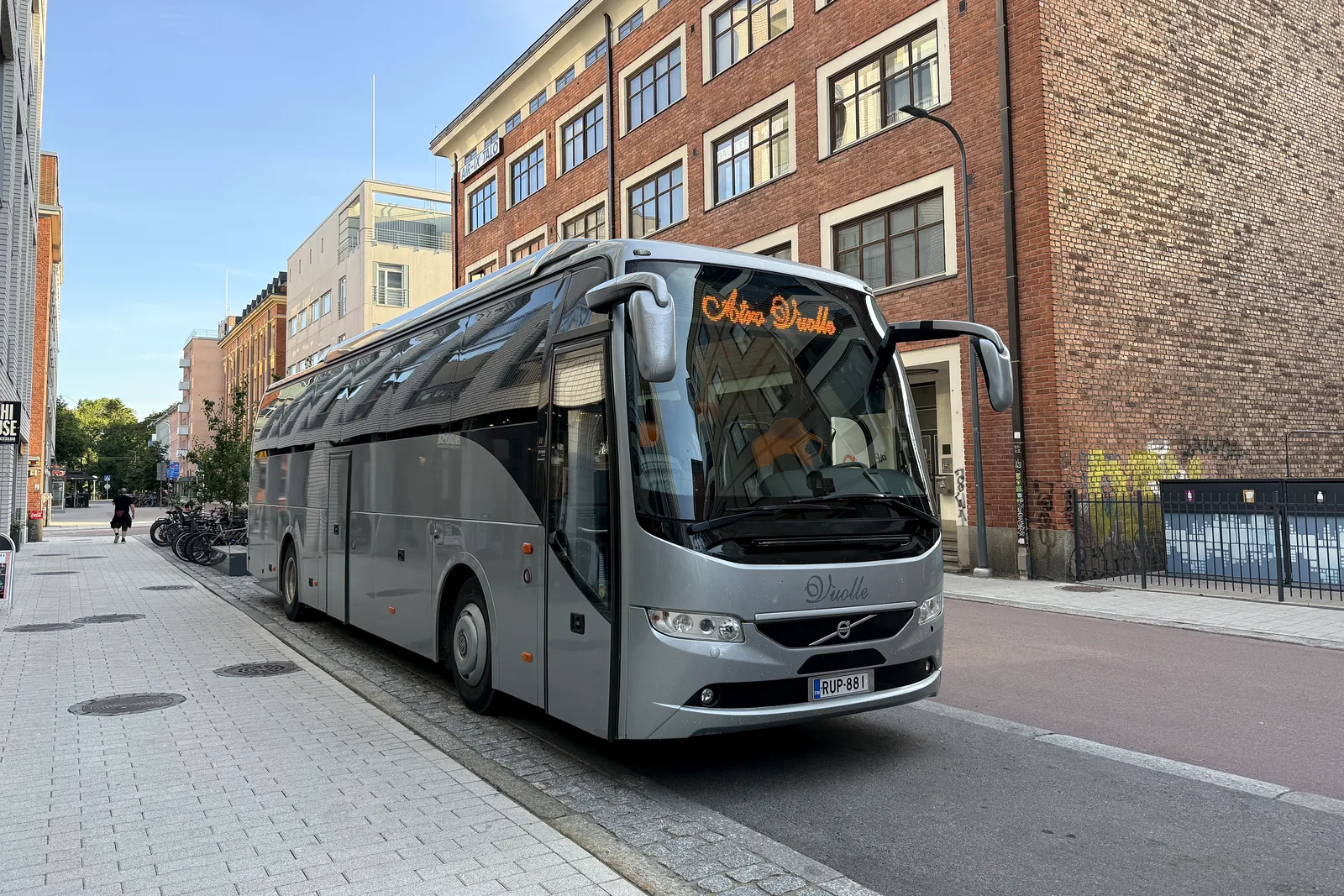 Atro Vuolle charter coach on a city street